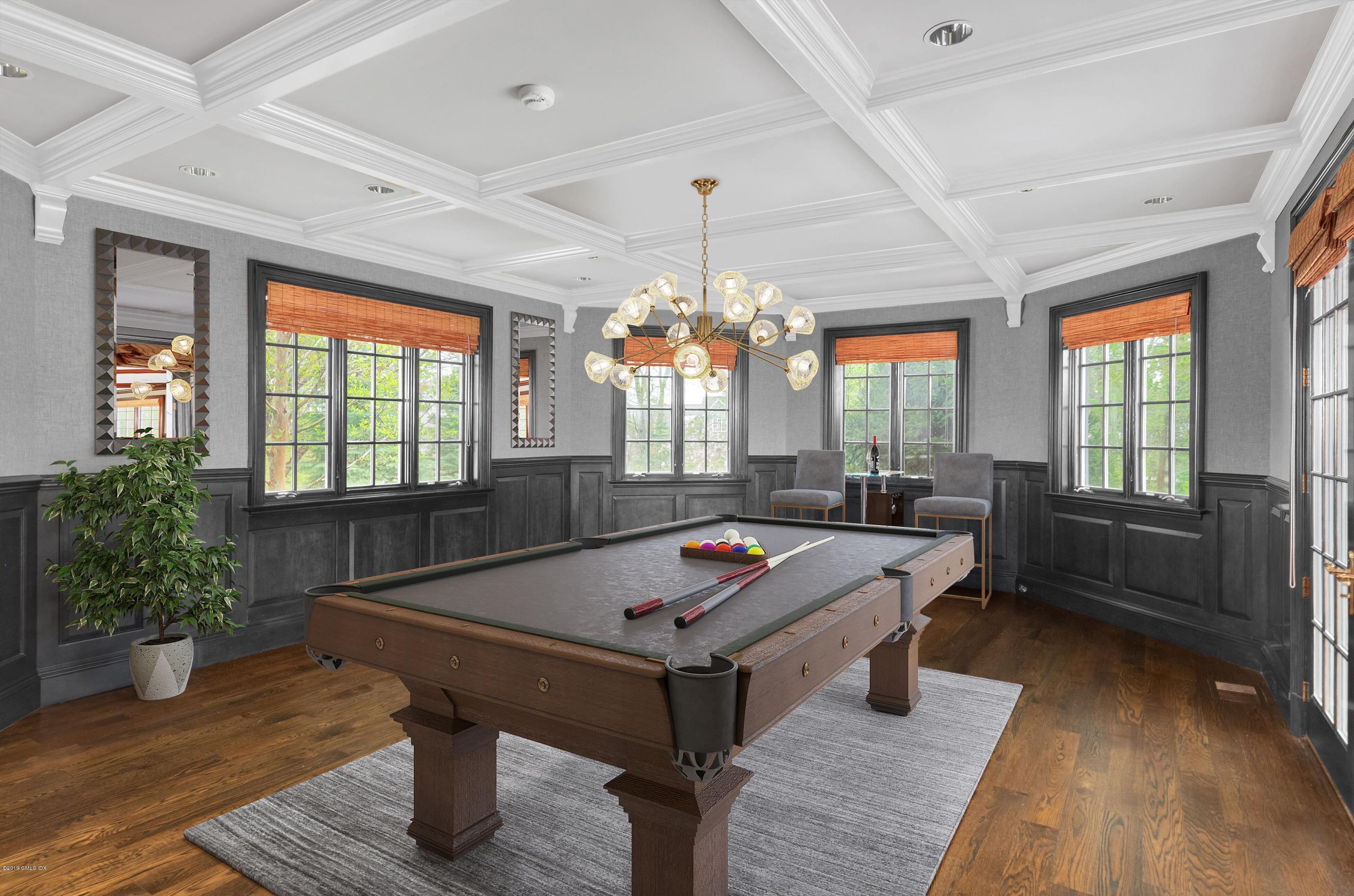 8 Juniper Hill Road Greenwich, CT 06830 - Photo 6 of 27 a living room with furniture a chandelier and a pool table