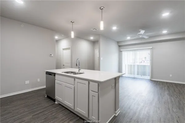 a view of a sink and a window in a room