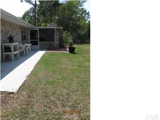 6911 Cedar Ridge Circle Milton, FL 32570 - Photo 2 of 11 Great Screened room with brick barbeque.