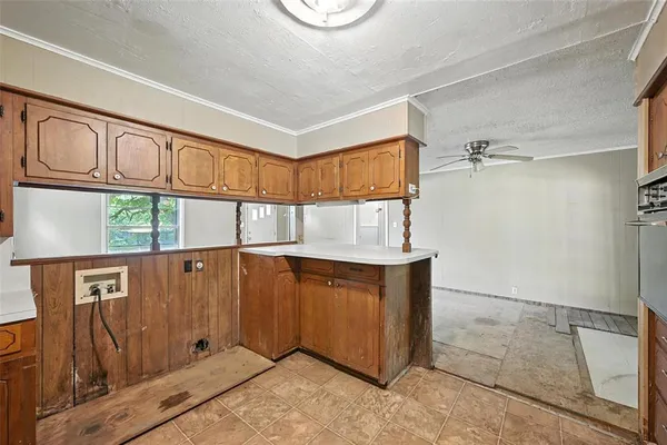 a kitchen with stainless steel appliances granite countertop a stove and a microwave