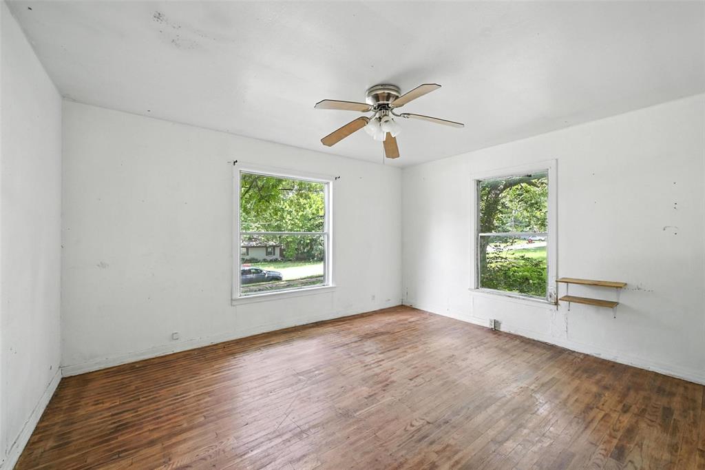 414 South Broadway Street Bells, TX 75414 - Photo 15 of 29 a view of room with window ceiling fan and hardwood floor