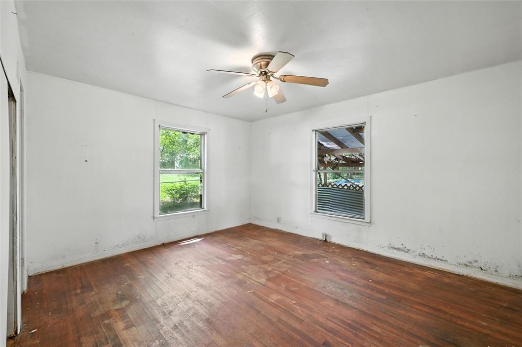 414 South Broadway Street Bells, TX 75414 - Photo 19 of 29 wooden floor in an empty room with a window