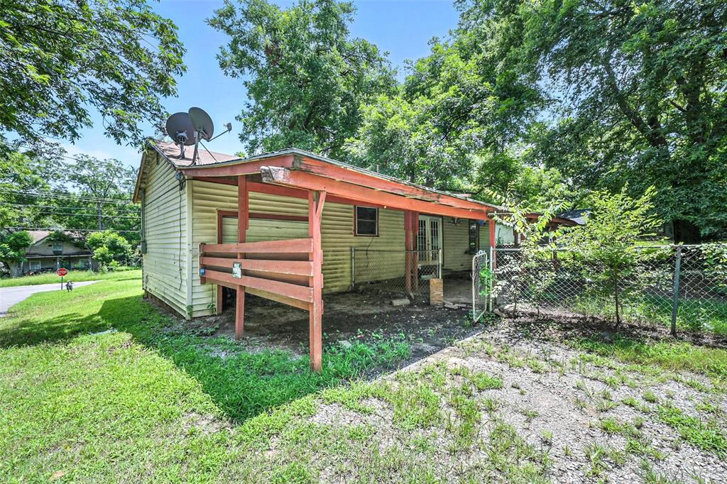414 South Broadway Street Bells, TX 75414 - Photo 24 of 29 a backyard of a house with outdoor seating and green space