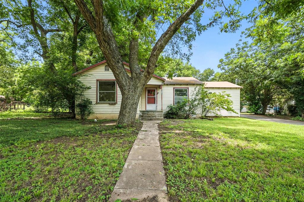 414 South Broadway Street Bells, TX 75414 - Photo 2 of 29 a front view of a house with a yard