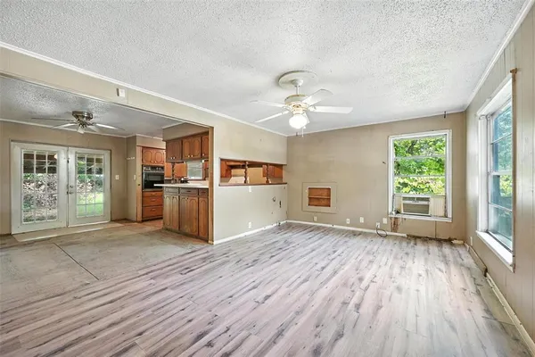 a view of a kitchen with wooden floor and a kitchen
