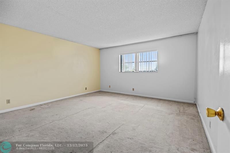 4750 Northwest 22nd Court, Unit 417 Lauderhill, FL 33313 - Photo 16 of 24 an empty room with a window