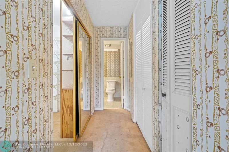 4750 Northwest 22nd Court, Unit 417 Lauderhill, FL 33313 - Photo 19 of 24 a view of a bathroom from a hallway