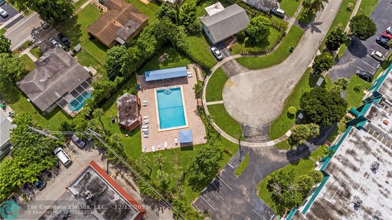 4750 Northwest 22nd Court, Unit 417 Lauderhill, FL 33313 - Photo 21 of 24 an aerial view of a house with a swimming pool outdoor seating and yard
