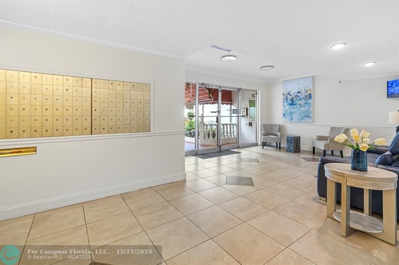 4750 Northwest 22nd Court, Unit 417 Lauderhill, FL 33313 - Photo 4 of 24 a living room with furniture and large window