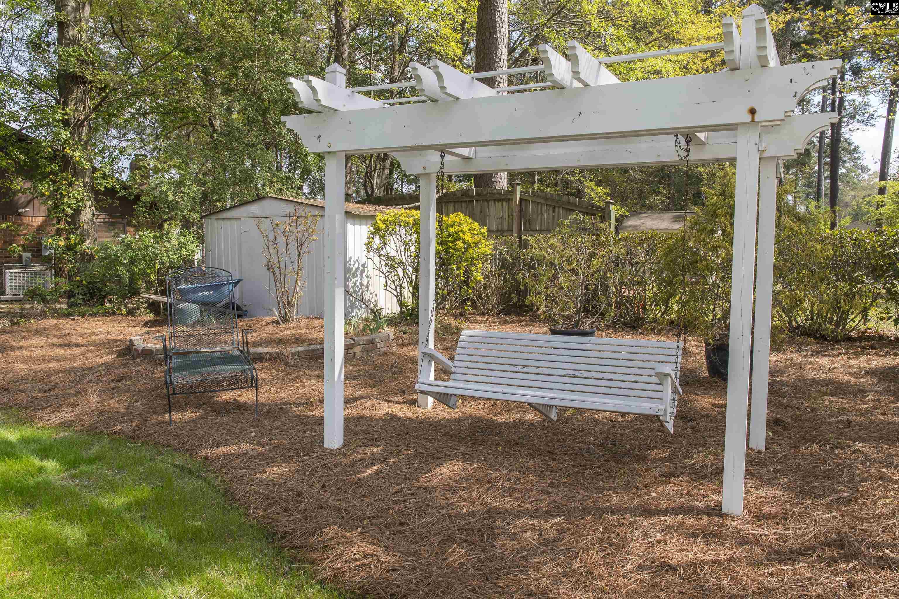 2309 Cunningham Road Columbia, SC 29210 - Photo 13 of 41 a view of a patio with table and chairs with wooden floor and fence