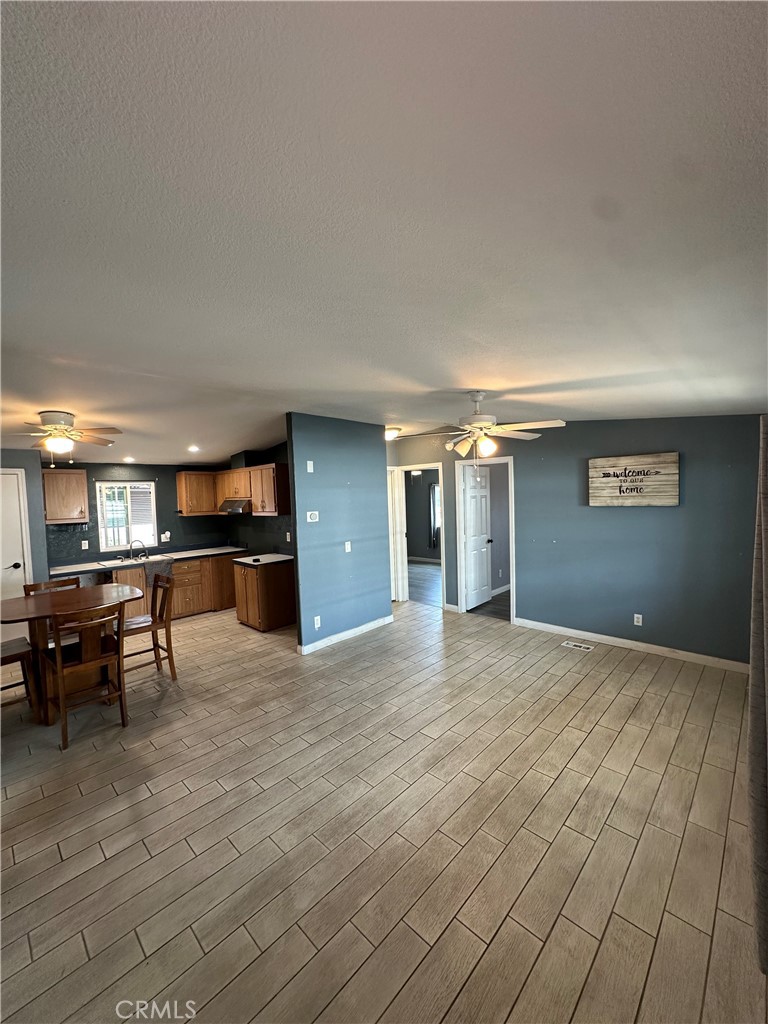 3825 Crestmore Road, Unit 414 Riverside, CA 92509 - Photo 8 of 31 a view of empty room with a fireplace and furniture