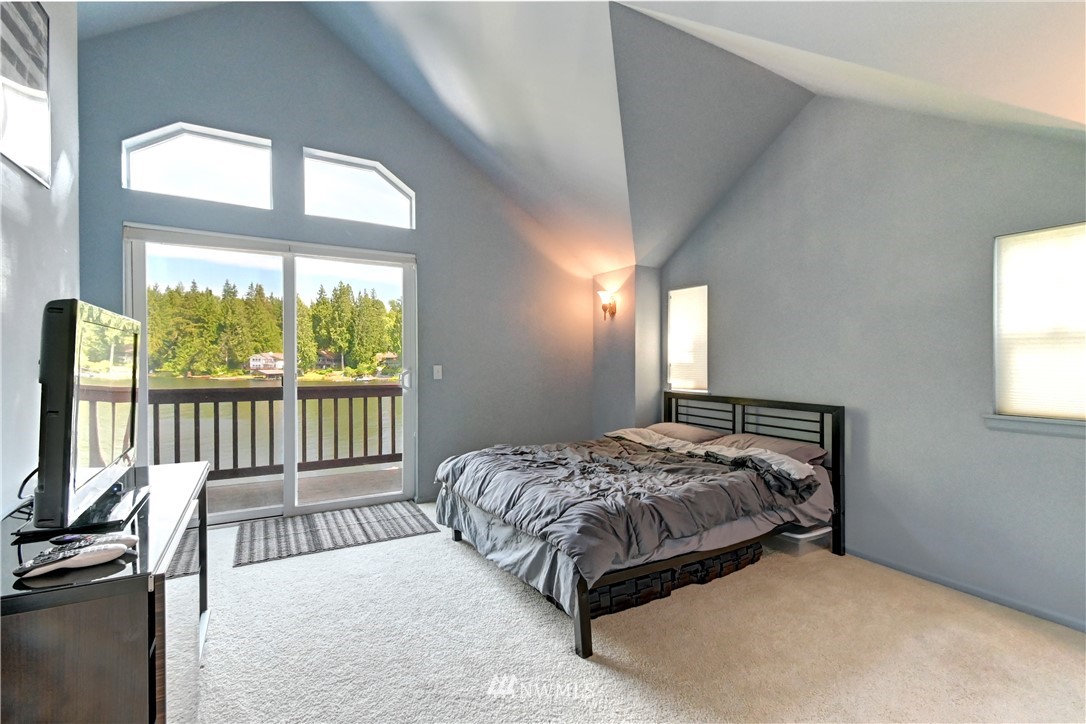 2503 Southwest Lake Roesiger Road Snohomish, WA 98290 - Photo 22 of 32 a bedroom with a bed and a window