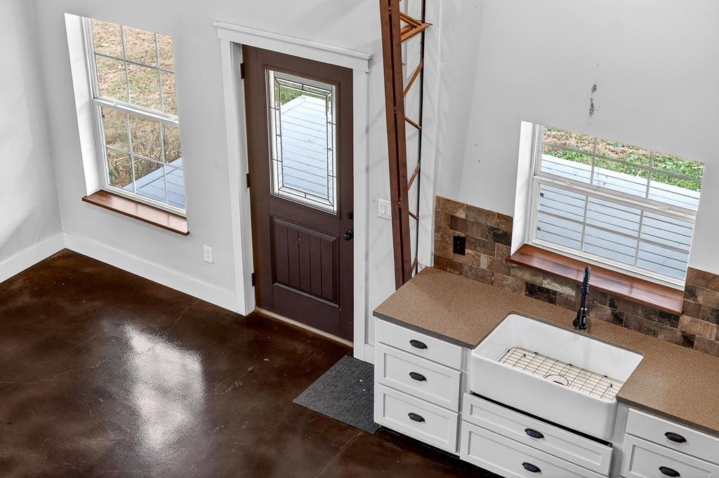 1425 Moodyville Loop Byrdstown, TN 38549 - Photo 17 of 62 a living room with furniture and large window