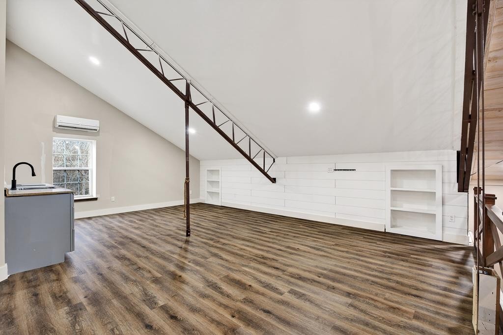 1425 Moodyville Loop Byrdstown, TN 38549 - Photo 30 of 62 a view of a livingroom with wooden floor