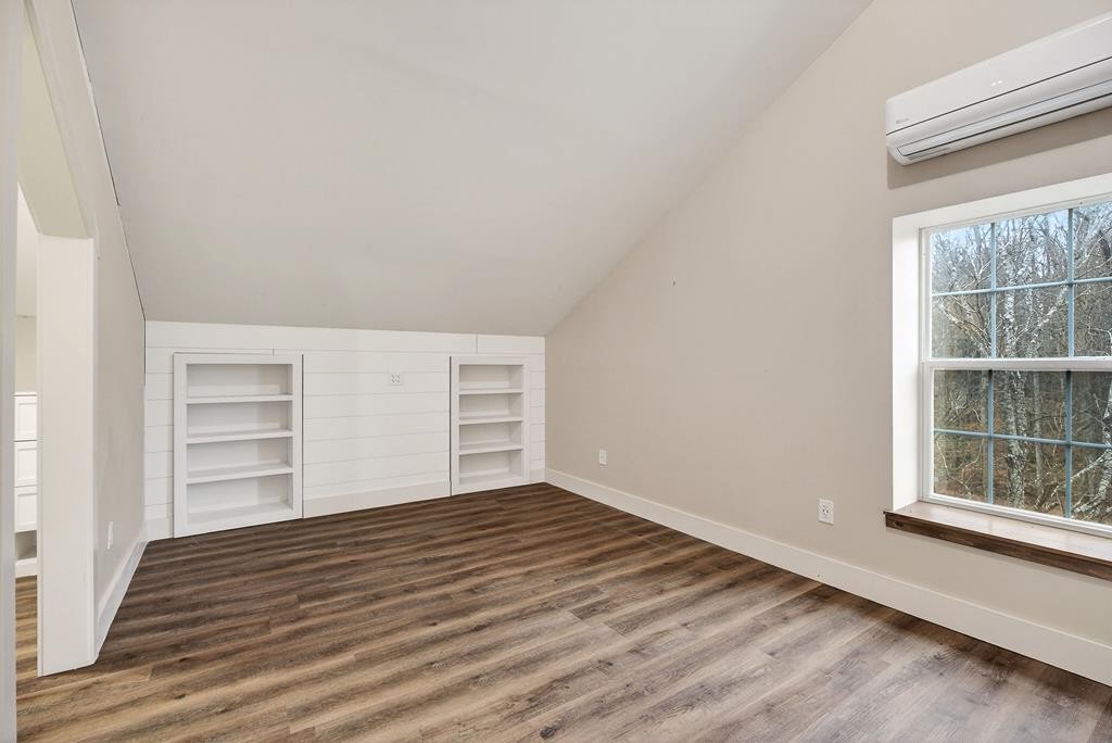1425 Moodyville Loop Byrdstown, TN 38549 - Photo 32 of 62 a view of empty room with wooden floor and fan