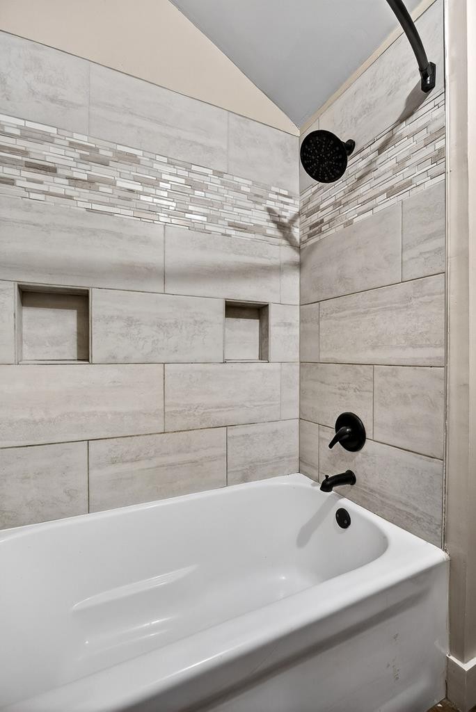 1425 Moodyville Loop Byrdstown, TN 38549 - Photo 34 of 62 a bathroom with a bathtub and shower