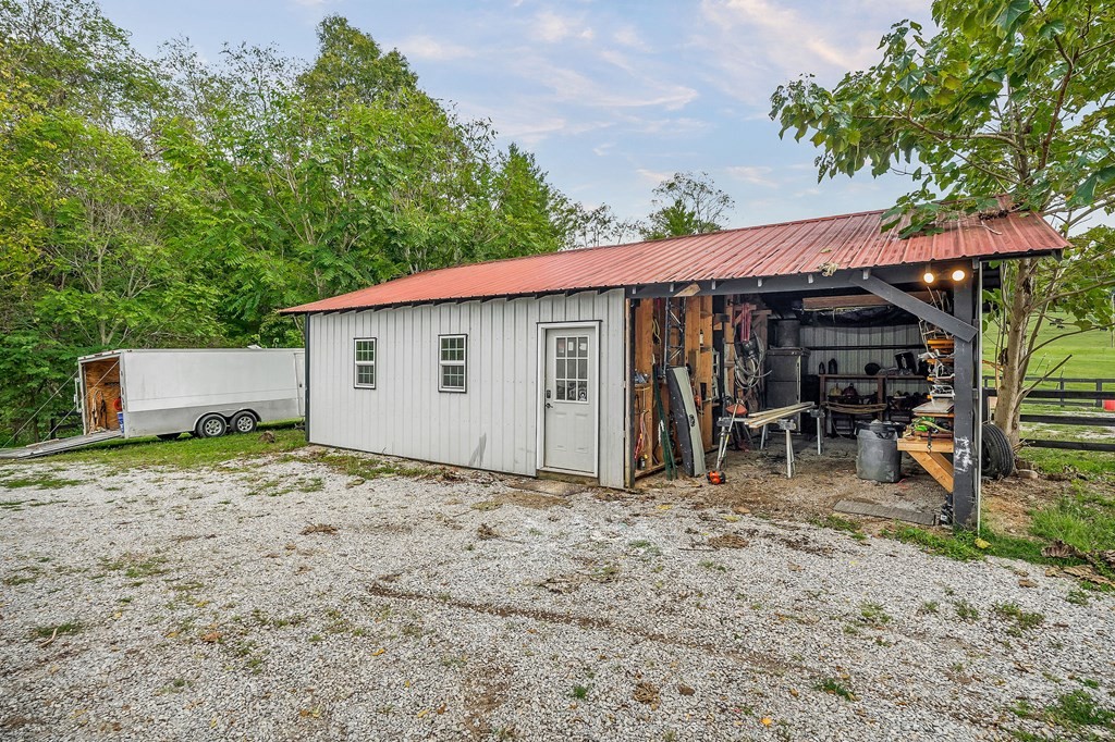 1425 Moodyville Loop Byrdstown, TN 38549 - Photo 51 of 62 a view of a house with backyard and sitting area