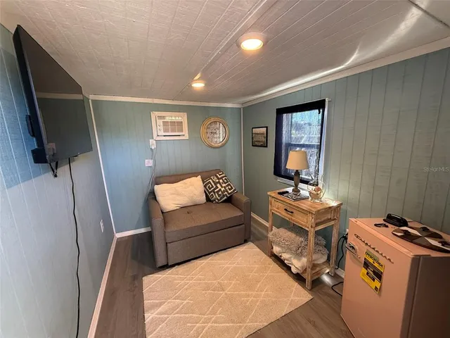 a bedroom with bed and a window