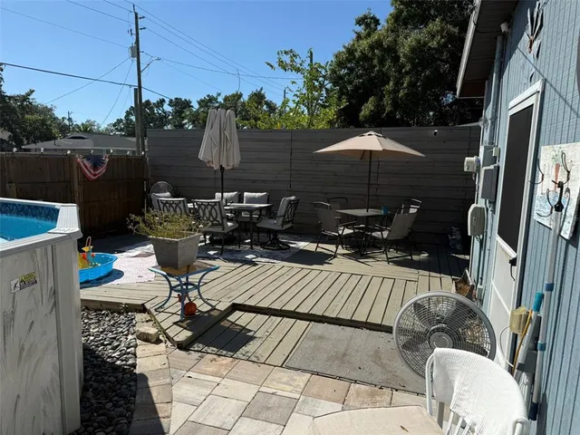 a view of a backyard with sitting area