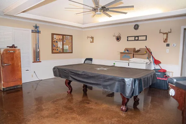a bed sitting in a room next to a window