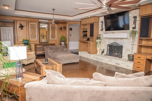 a living room with furniture and a fireplace