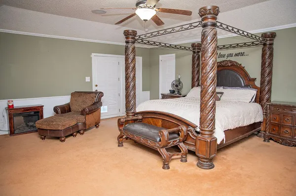 a bedroom with bed and window
