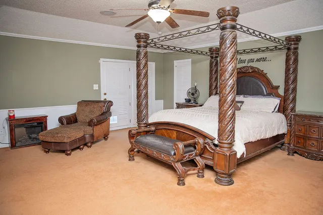 a bedroom with bed and window