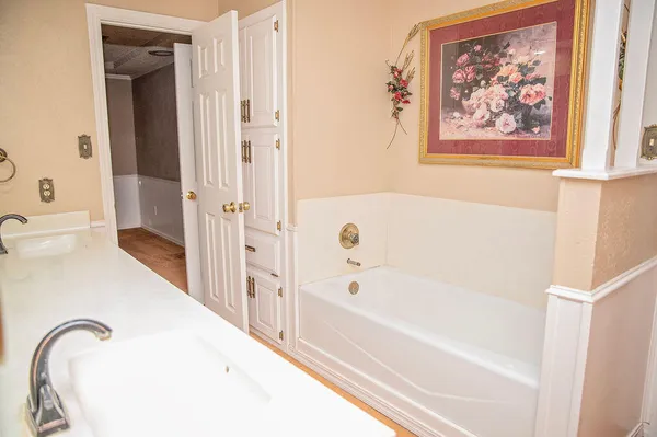 a bathroom with a bathtub and a shower