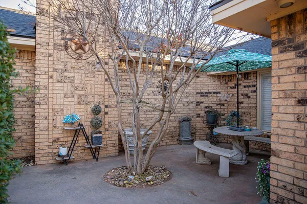 a front view of a house with outdoor seating