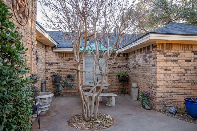 a front view of a house with outdoor seating
