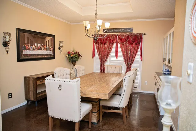 a dining room with furniture and window