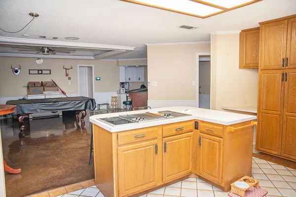 a kitchen with a stove and a refrigerator