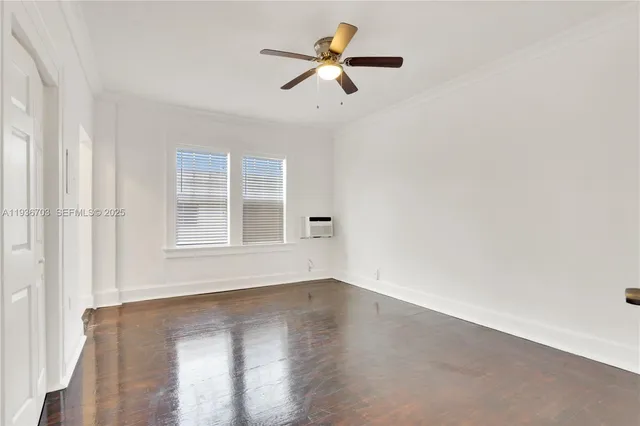 a bedroom with furniture and wooden floor
