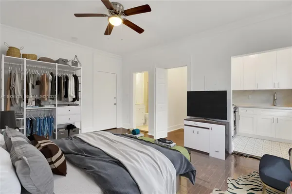 a kitchen with stainless steel appliances granite countertop a refrigerator a stove and a sink