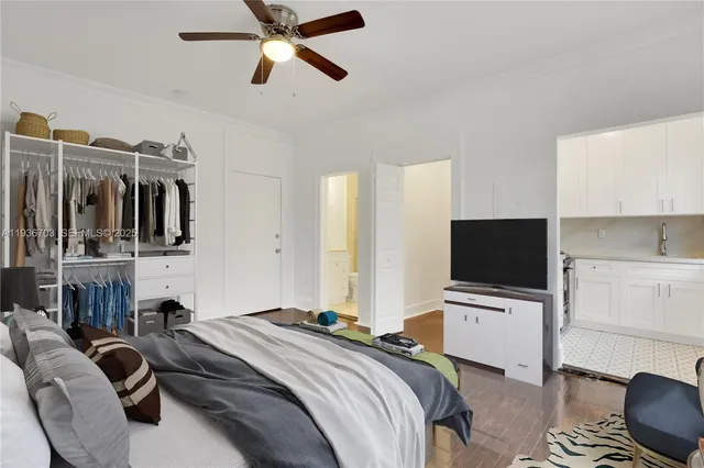 a kitchen with stainless steel appliances granite countertop a refrigerator a stove and a sink