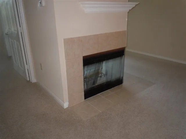 a view of a glass door and a yard from a balcony