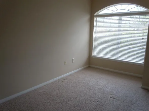 a view of empty room with windows