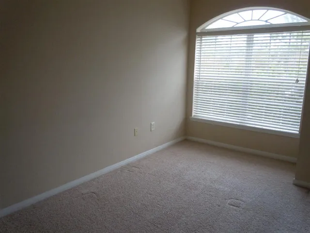 a view of empty room with windows