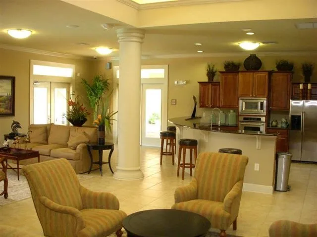 a front view of a house with outdoor seating