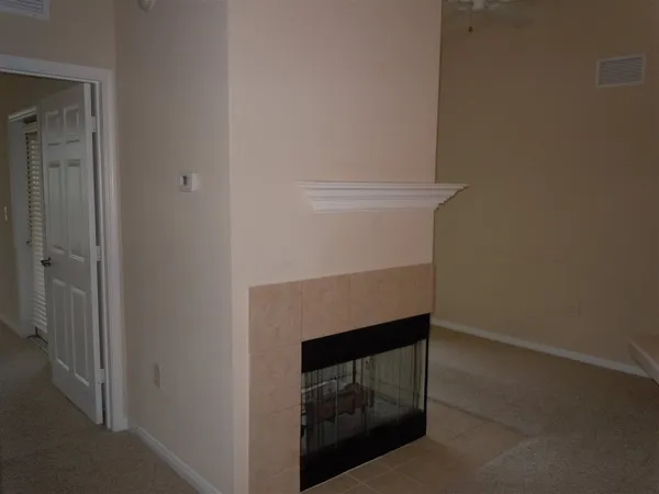 a view of an empty room with a balcony