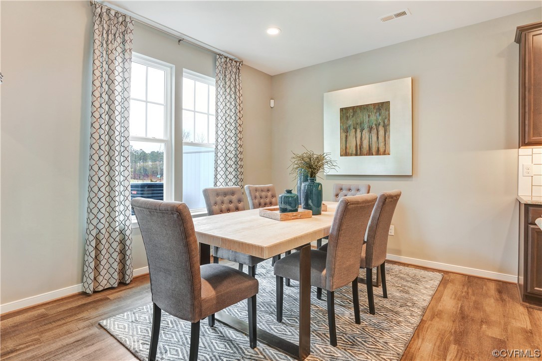18637 Palisades Ridge Moseley, VA 23120 - Photo 13 of 41 a view of a dining room with furniture and wooden floor