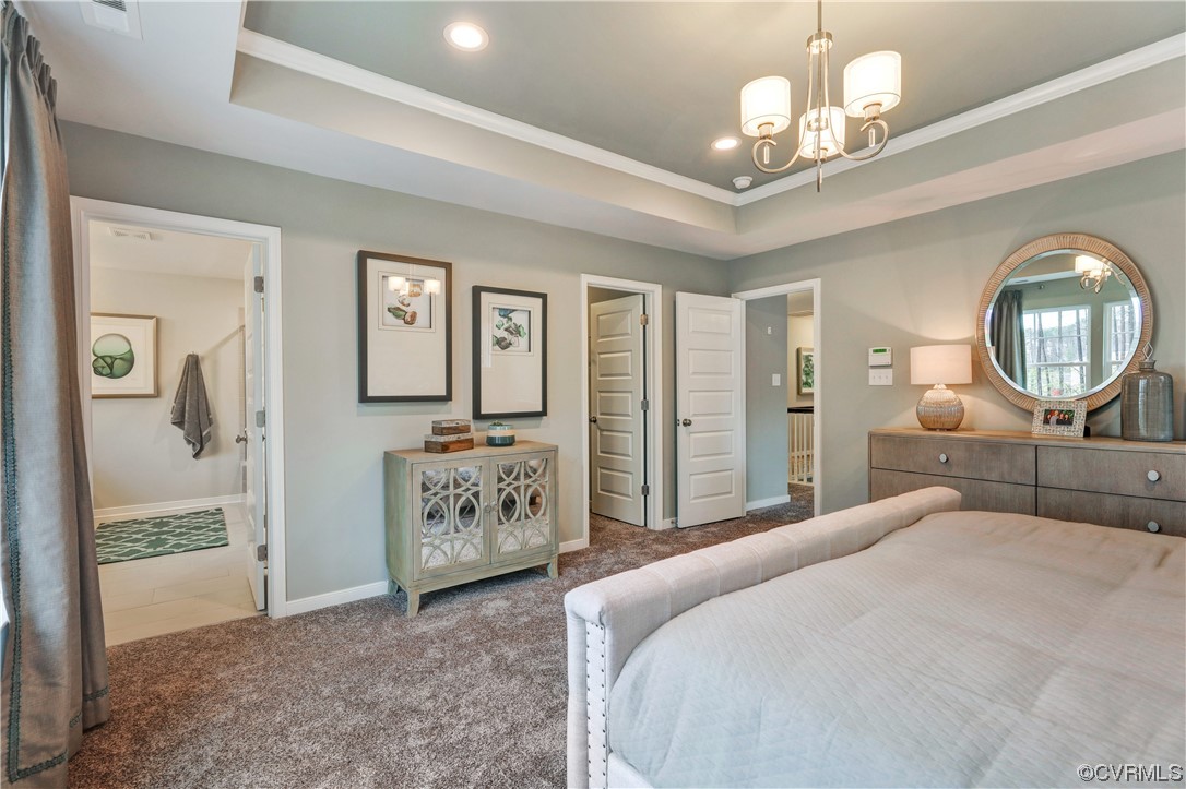 18637 Palisades Ridge Moseley, VA 23120 - Photo 20 of 41 a bedroom with a large bed and a chandelier