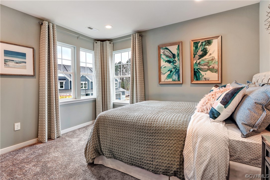 18637 Palisades Ridge Moseley, VA 23120 - Photo 24 of 41 a bedroom with a large bed and a window