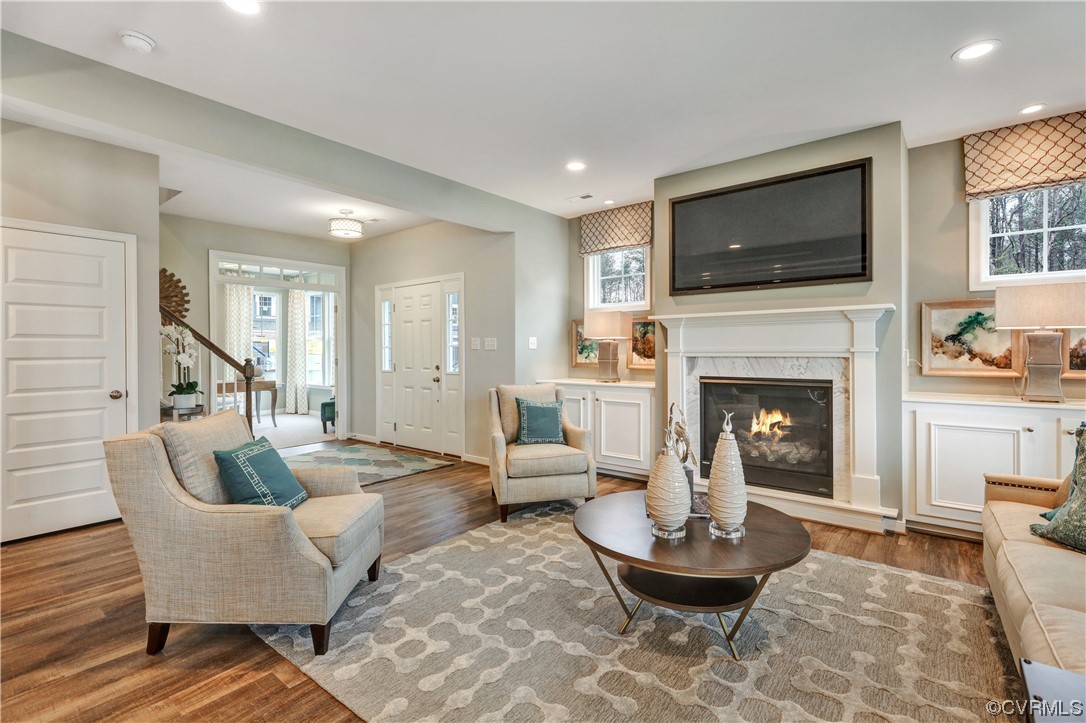 18637 Palisades Ridge Moseley, VA 23120 - Photo 8 of 41 a living room with furniture a flat screen tv and a fireplace