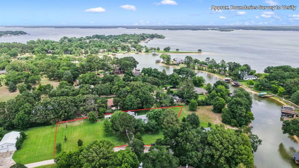 455 Stirrup Ranch Road Trinidad, TX 75163 - Photo 2 of 20 an aerial view of residential houses with outdoor space and lake view