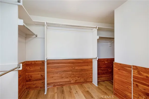 a bathroom with a bathtub sink vanity and mirror