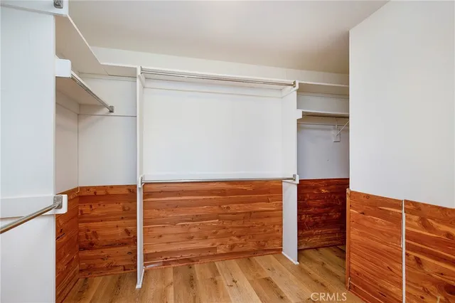 a bathroom with a bathtub sink vanity and mirror