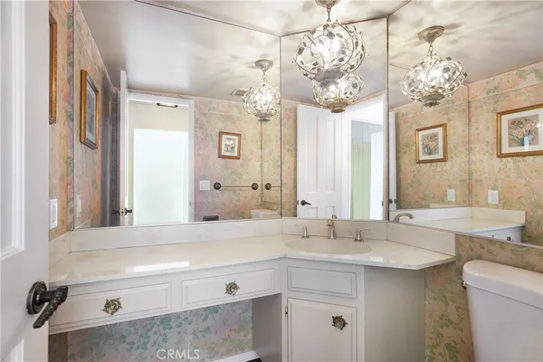 a view of a porch with a floor to ceiling window and stairs