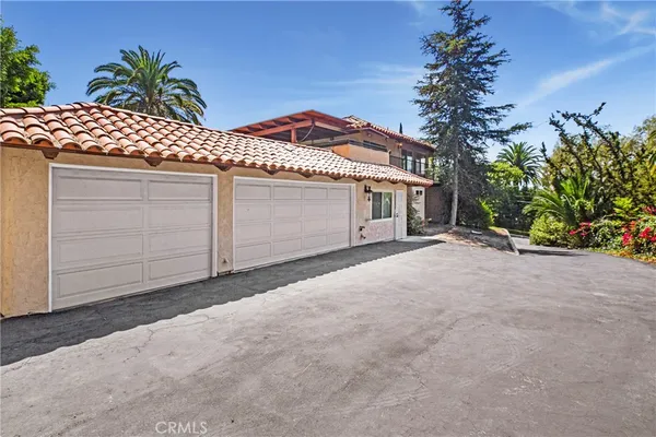 a front view of a house with a garage
