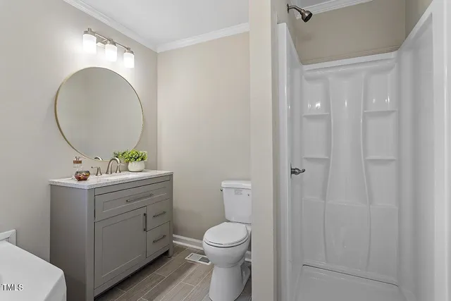 a bathroom with a sink and mirror with bathtub